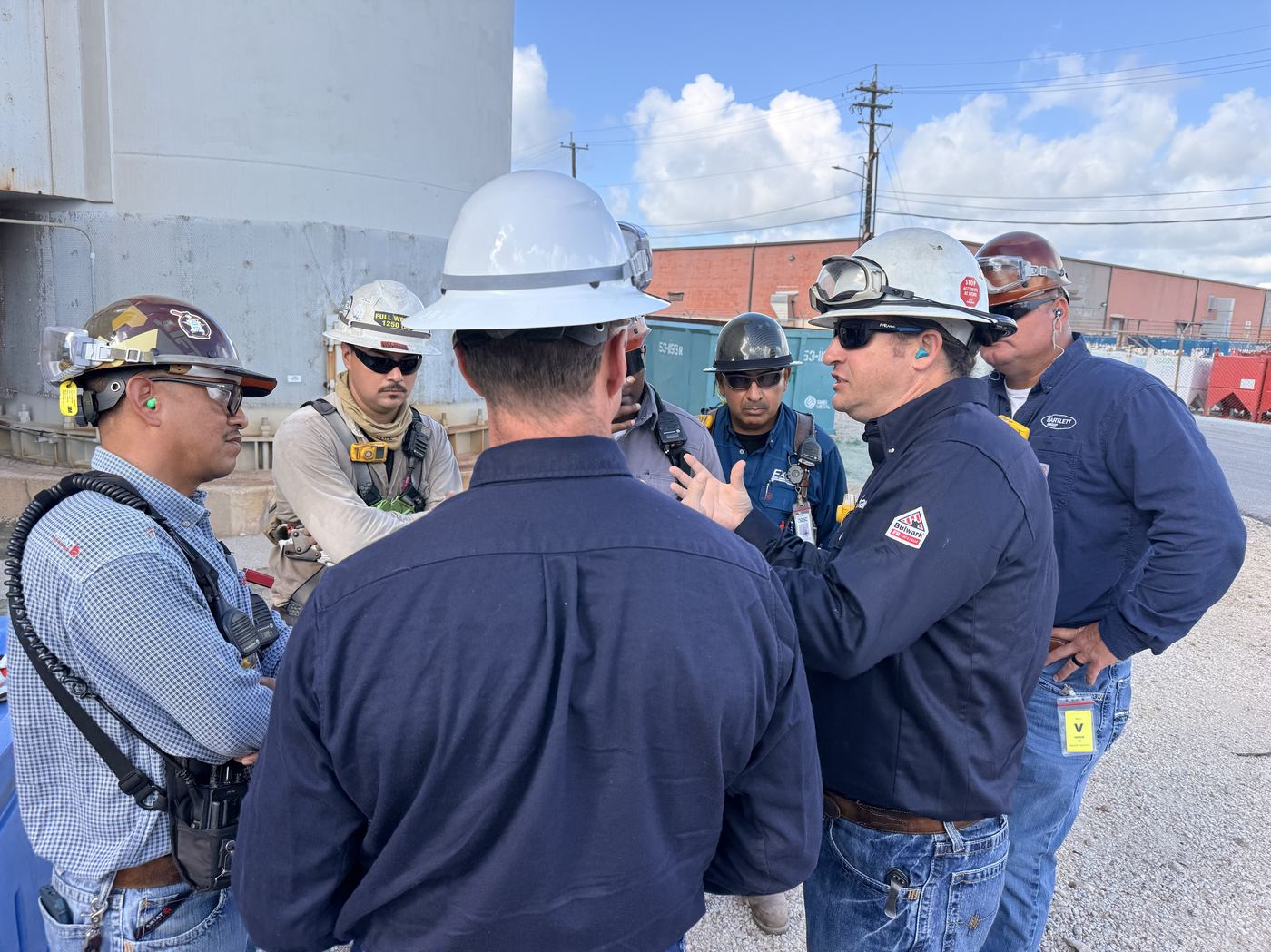 A safety lead walking the crew through the job steps